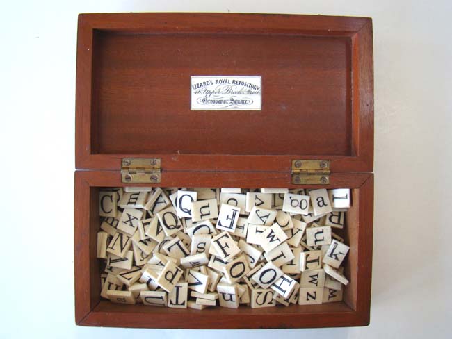 A fantastic set of antique Bone Alphabet tiles in its' original mahogany box dated 1864